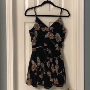 Rixxi spaghetti strap romper in size small.